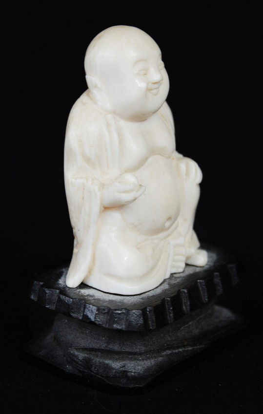 small carved ivory buddha