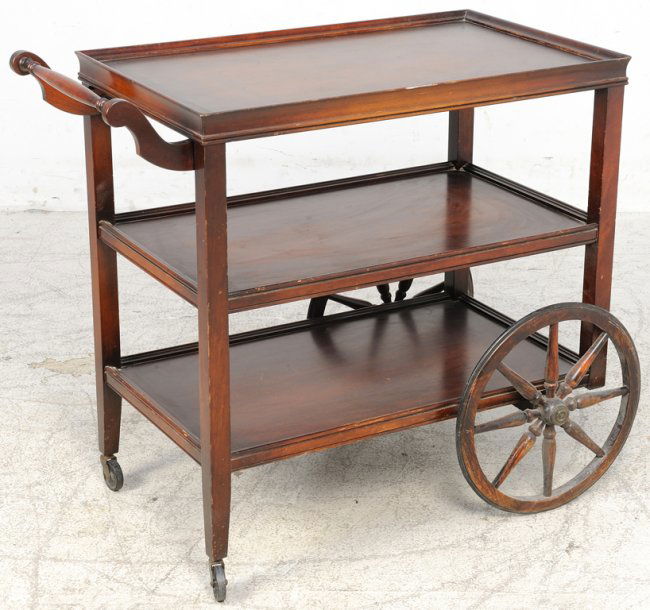 A VINTAGE ROLLING SERVING CART WITH WAGON WHEELS Lot 124