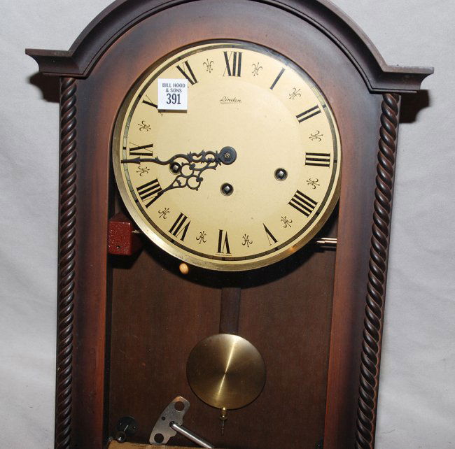 391 Linden wood wall clock, Westminster chimes, 18"h Lot 391