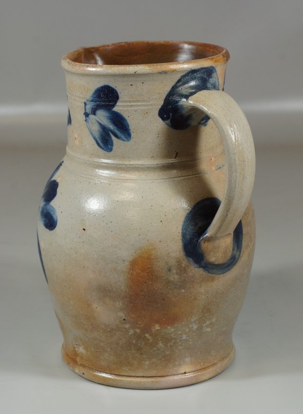 Blue floral decorated stoneware pitcher in the manner Lot 12667