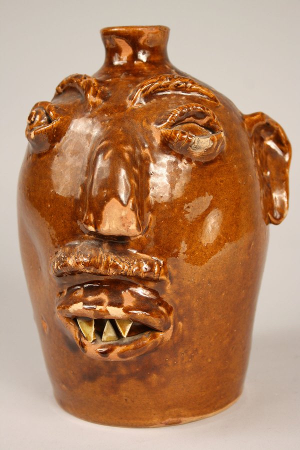 200 Brown pottery face jug, North Carolina Lot 200