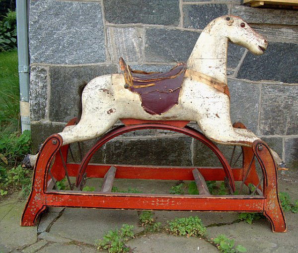 78 Antique wooden hobby horse with painted base Lot 78